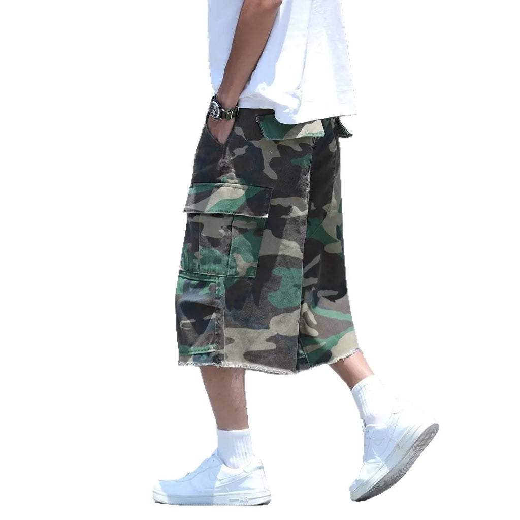 Man's loose-fit cotton shorts in a camouflage print with a cropped length and retro workwear style.
