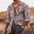 Man wearing a loose fit long sleeve shirt with a detailed 3D flower pattern print