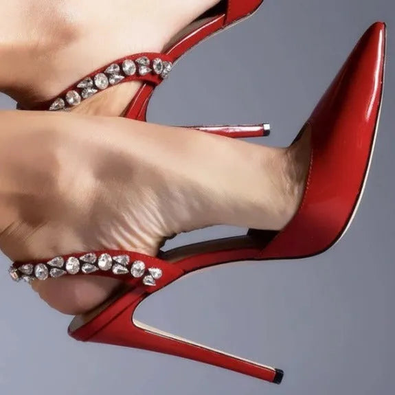 Women's pointed toe high heel sandals with rhinestone side detail on patent leather upper.