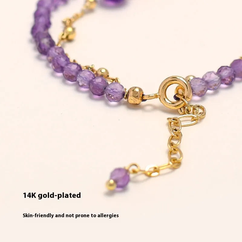 Purple amethyst crystal bracelet with diamond-shaped beads in a Chinese style design.