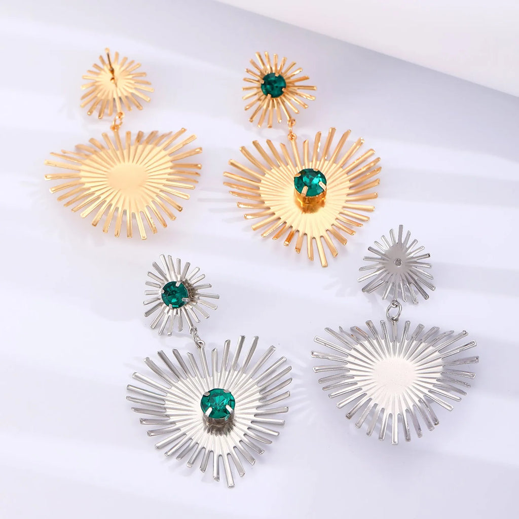Alloy bohemian sunflower heart-shaped earrings with rhinestones in gold finish on white background