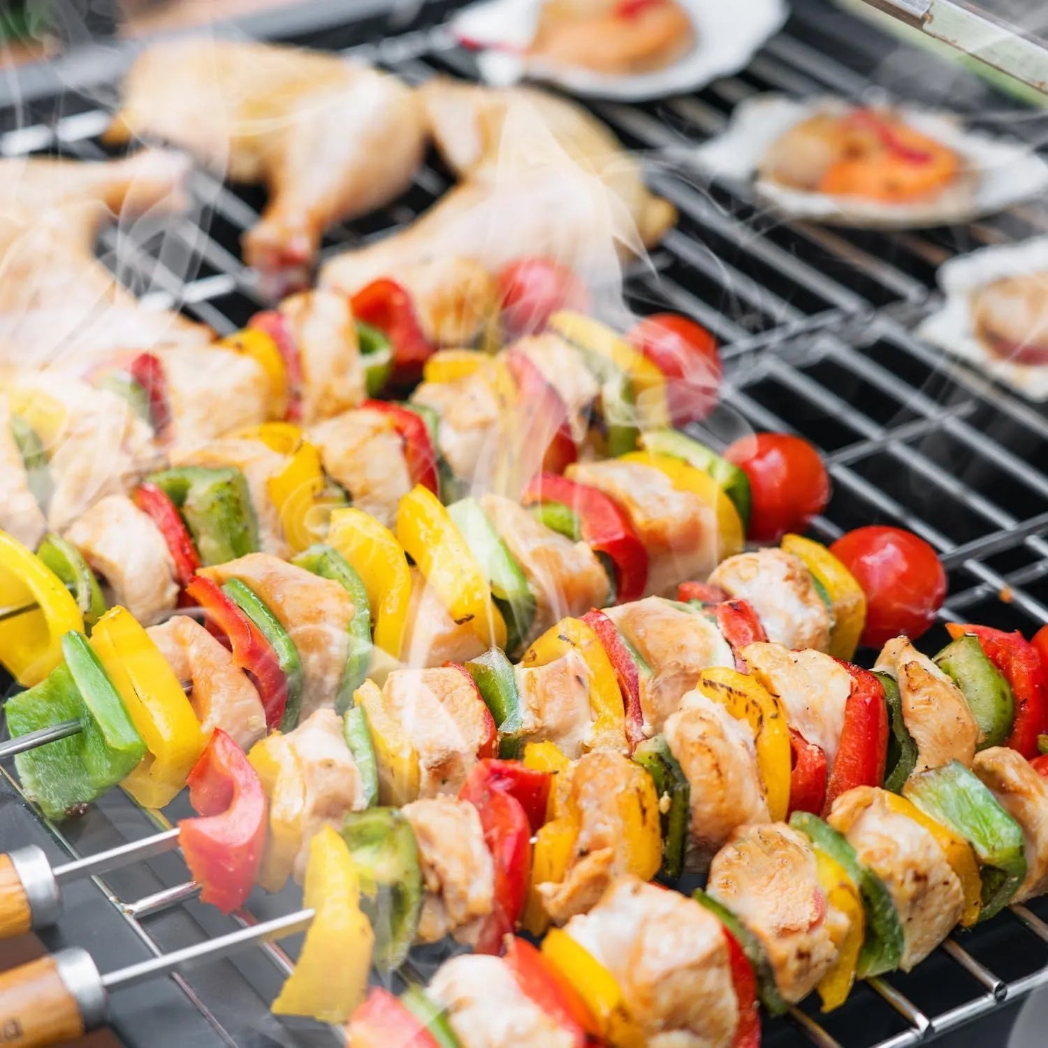Extra large charcoal barbecue grill with foldable side tables and black metal body