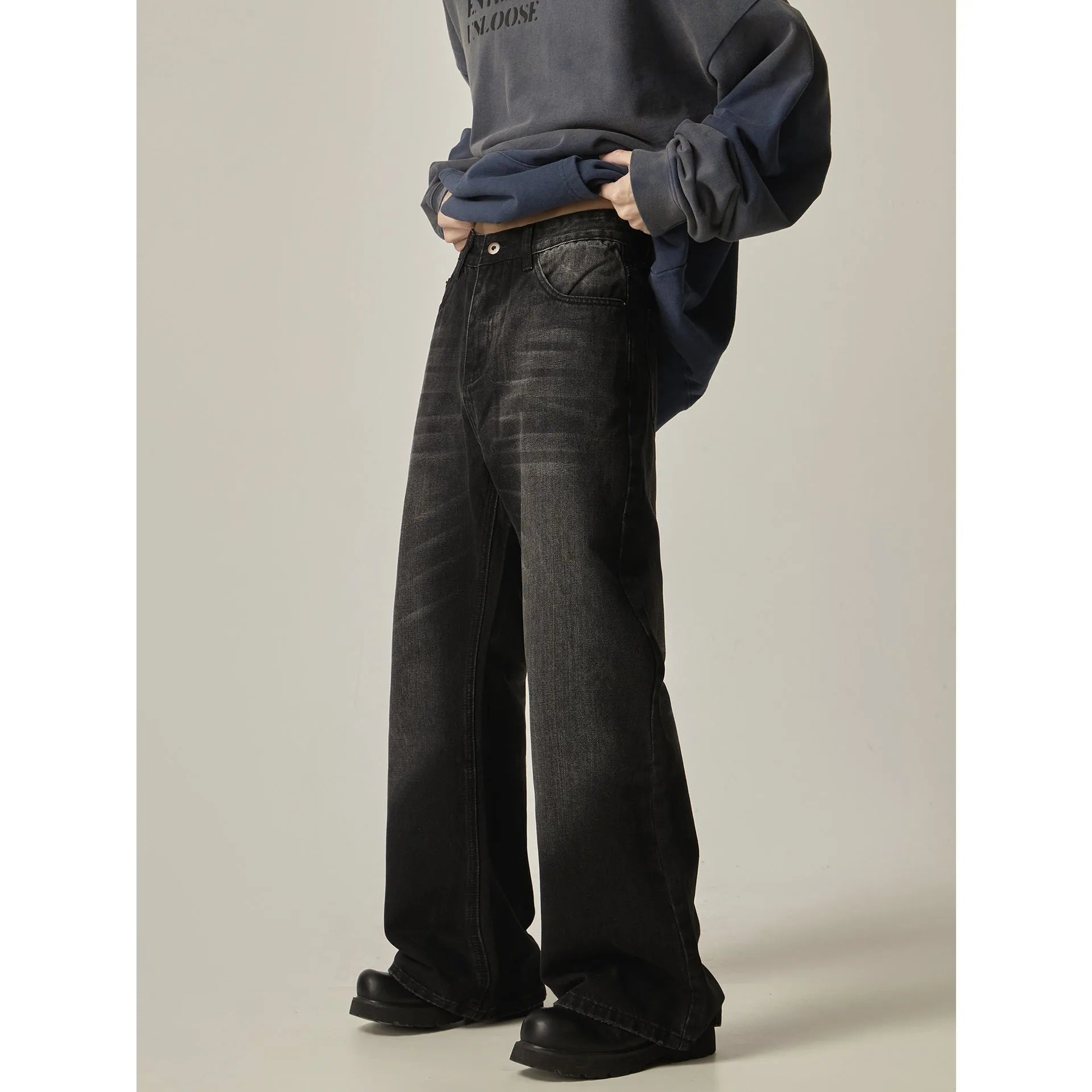 Black loose straight jeans with retro American styling and zipper fly opening