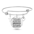 Silver stainless steel bangle bracelet with 25mm cross pendant on a white background