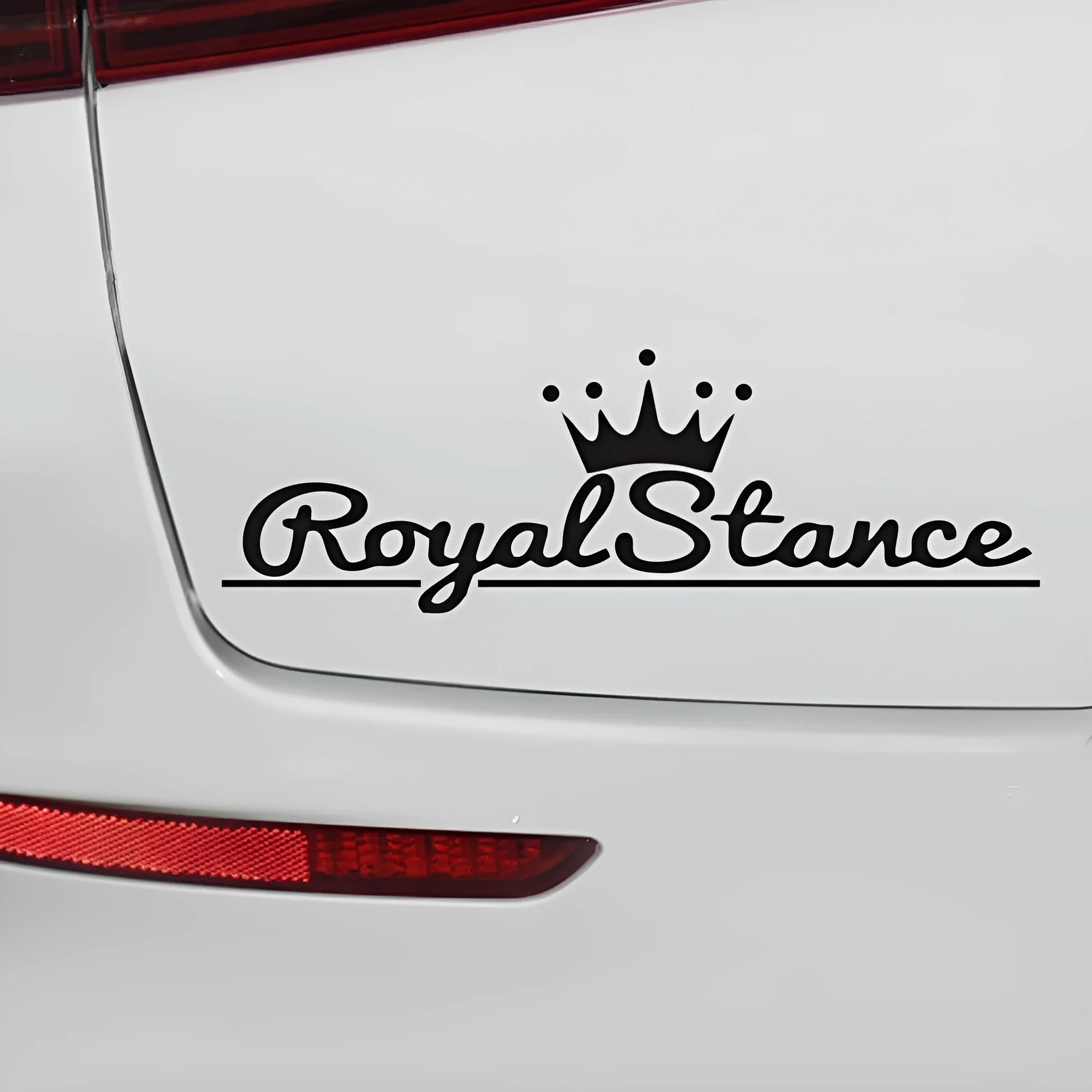 Reflective crown car sticker on vehicle surface showing black, white and colourful options