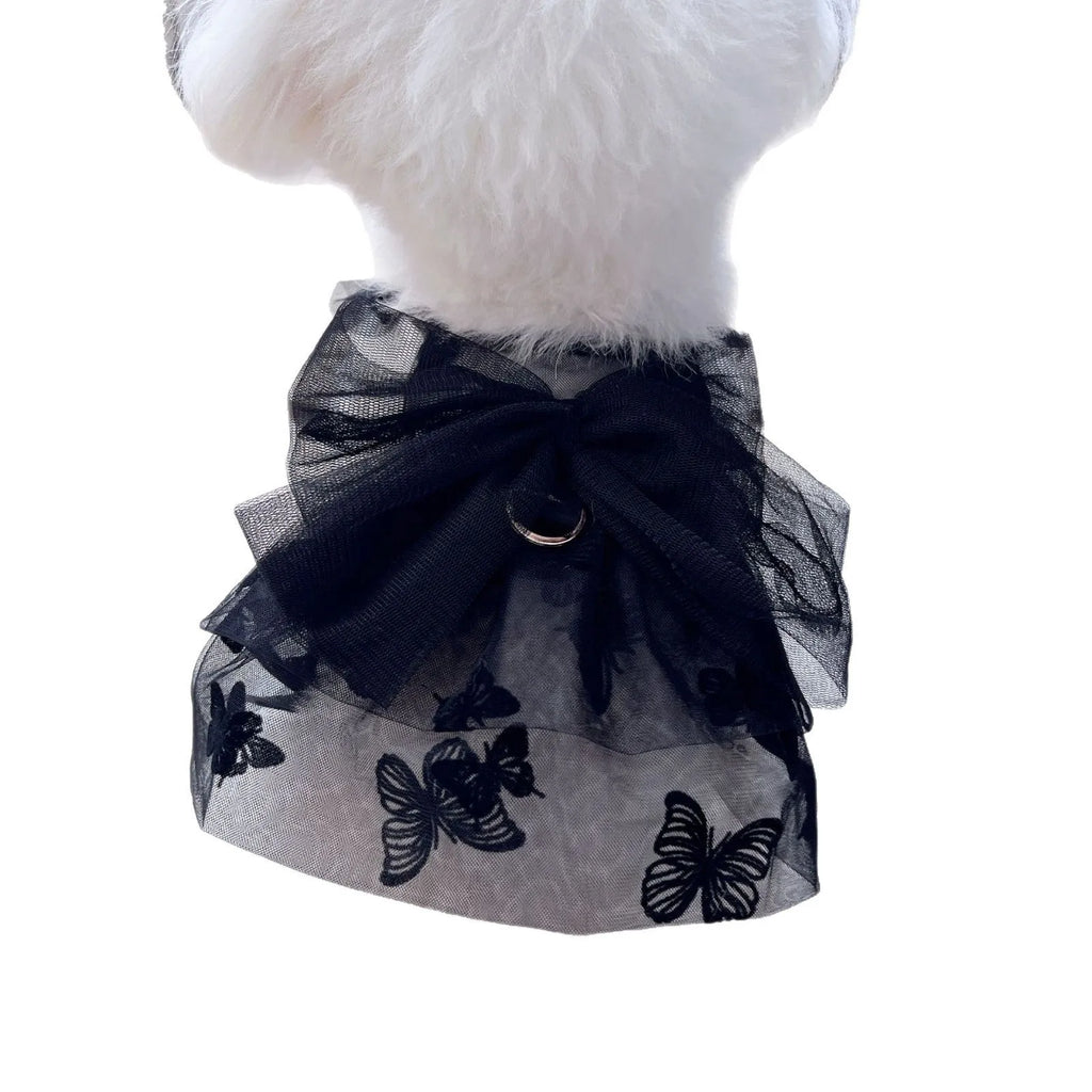Black polyester tulle princess skirt for a small dog or cat on a hanger.