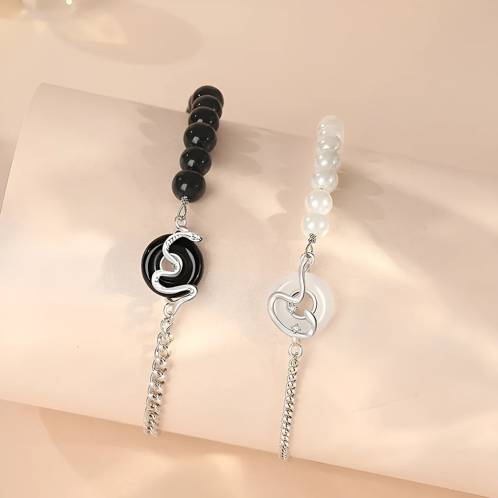 A pair of 925 sterling silver bracelets for men and women featuring a snake zodiac charm and a safety buckle clasp.