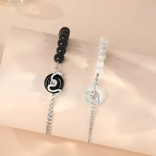 A pair of 925 sterling silver bracelets for men and women featuring a snake zodiac charm and a safety buckle clasp.