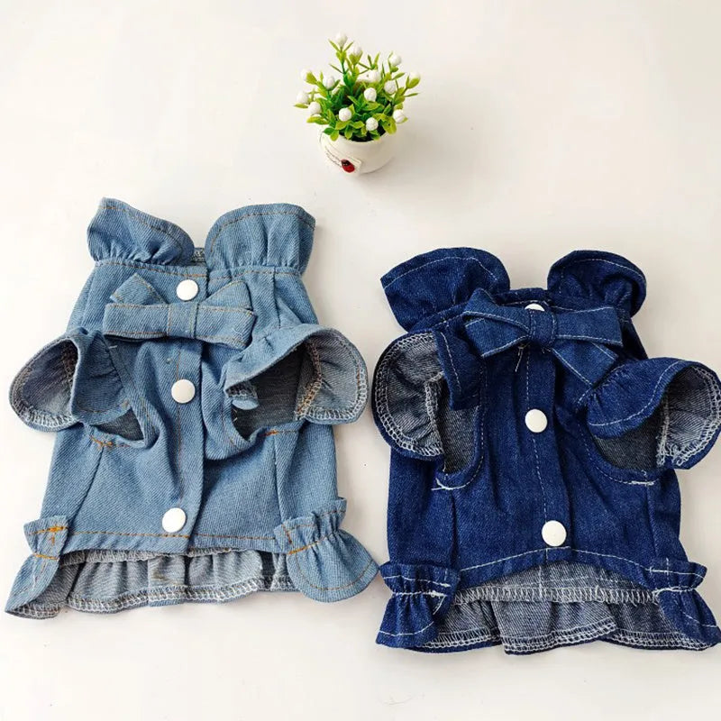 Blue denim dog dress with ruffles and a chest harness leash hook on a mannequin.