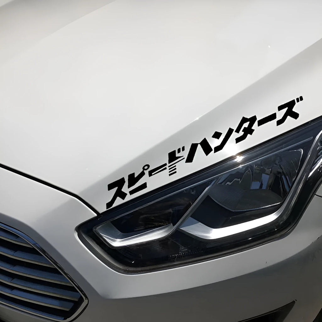 Black and white 35x35cm square reflective Japanese car sticker on a vehicle window.