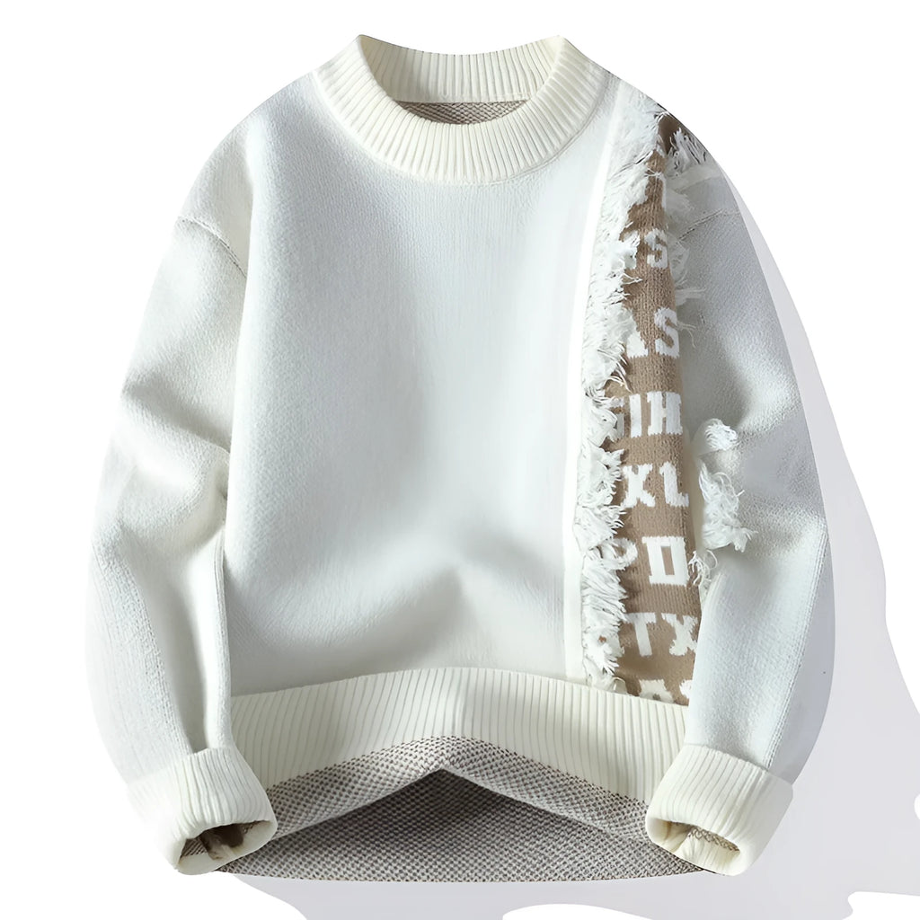 Man wearing a loose fit grey knitted pullover with long sleeves and a ribbed hemline.