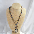 Tribal style necklace with two-layer pendant featuring natural stone and glass elements on chain