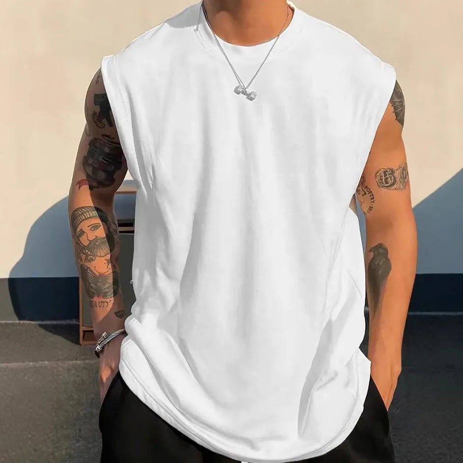 Men's loose fit solid colour cotton tank top shown in apricot, available in sizes up to 5XL.