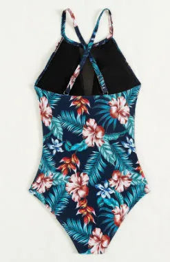 Women's printed one-piece swimsuit with deep V neckline on a mannequin, showing gradient colour design.