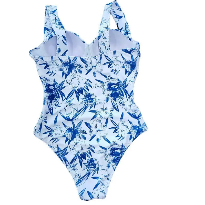 One-piece white polyester swimsuit for women with printed pattern and flab hiding gather design