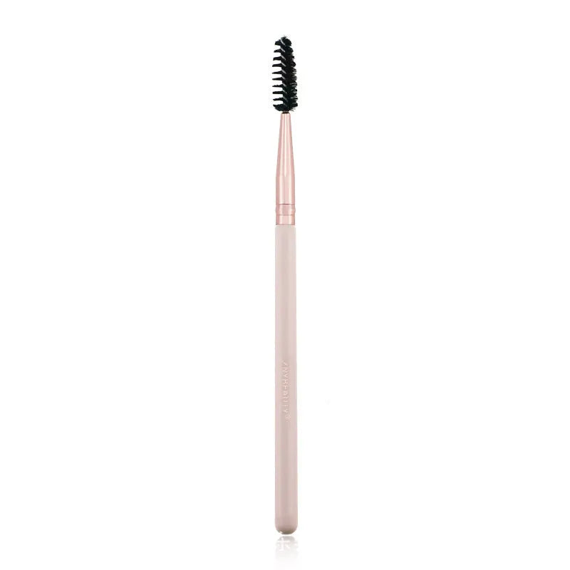 26 pink makeup brushes with wooden handles laid out next to a matching storage bag.