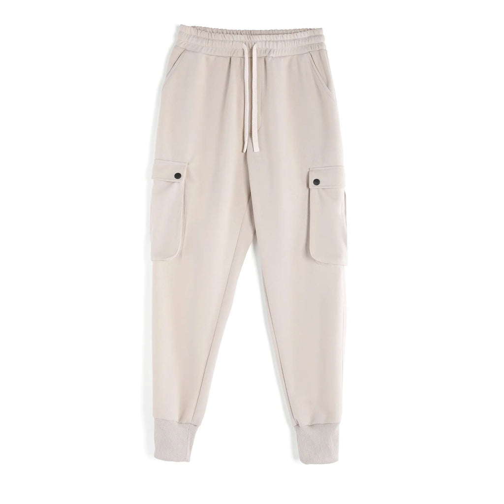 Men's loose cotton trousers with ankle ties in apricot colour showing multi-pocket design