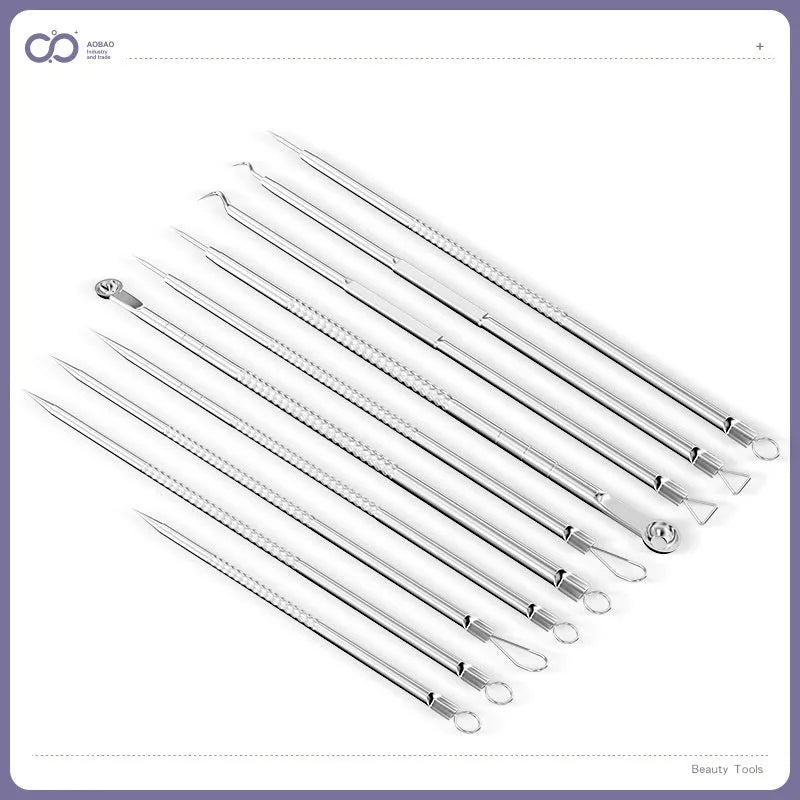 Four metal acne needles with ultra-fine pointed tips laid out in a set.