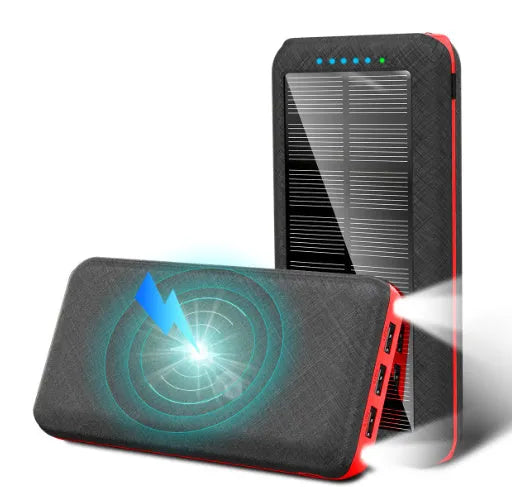 Black solar power bank with wireless Qi charging pad, three USB ports, and an LED flashlight