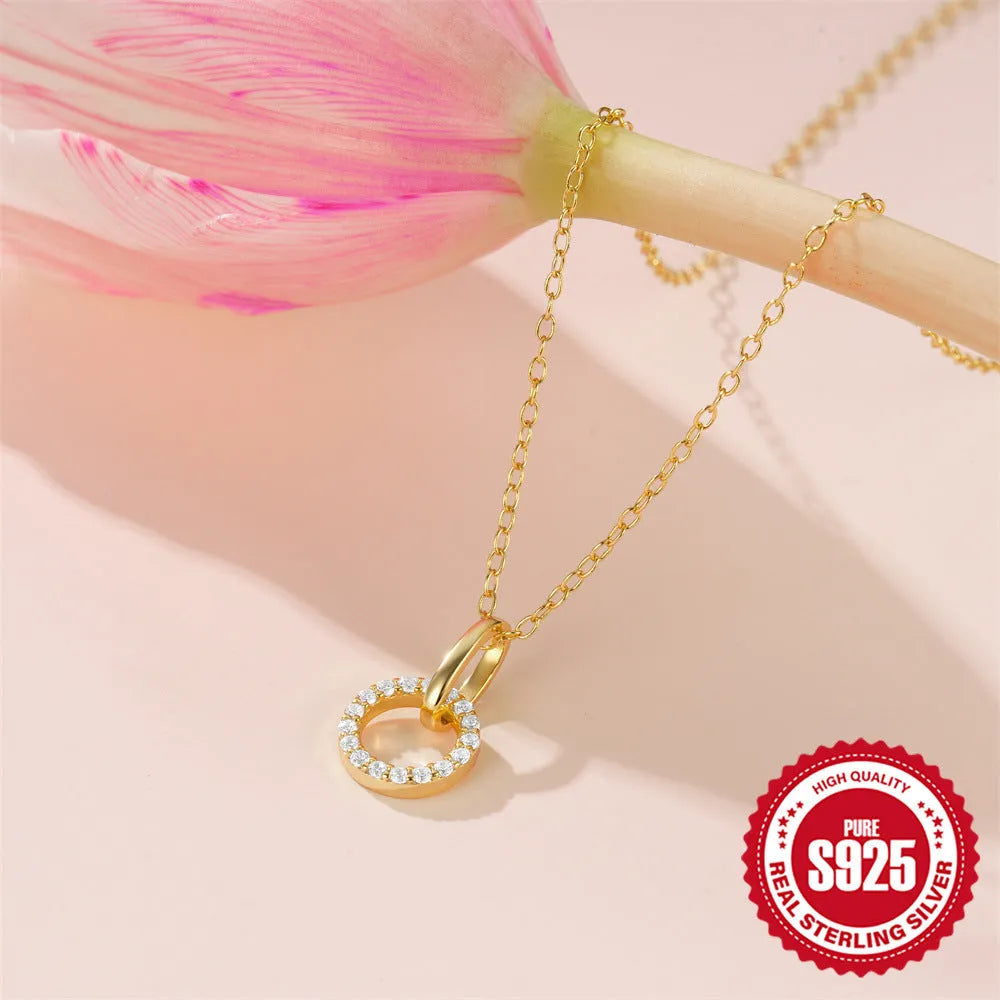 Gold-coloured S925 sterling silver clavicle necklace with a geometric interlocking zircon pendant on an adjustable chain.