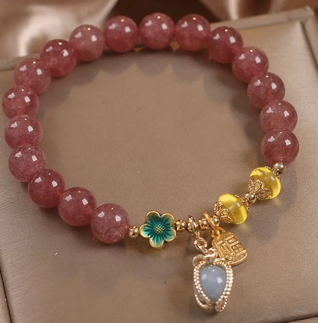 Red strawberry quartz beaded bracelet with alloy metal accents and rhinestone decorative details for women