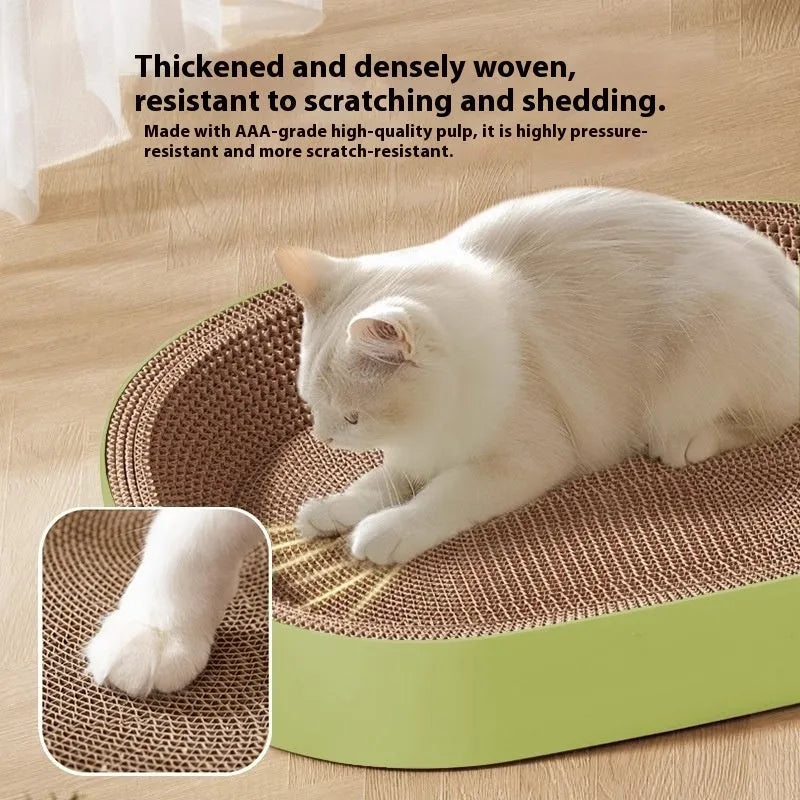 Green oval corrugated paper cat scratch board measuring 55cm across, functioning as both scratching surface and cat nest