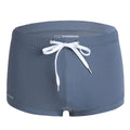 Men's low-waist boxer style swimming trunks in nylon, available in multiple colours.