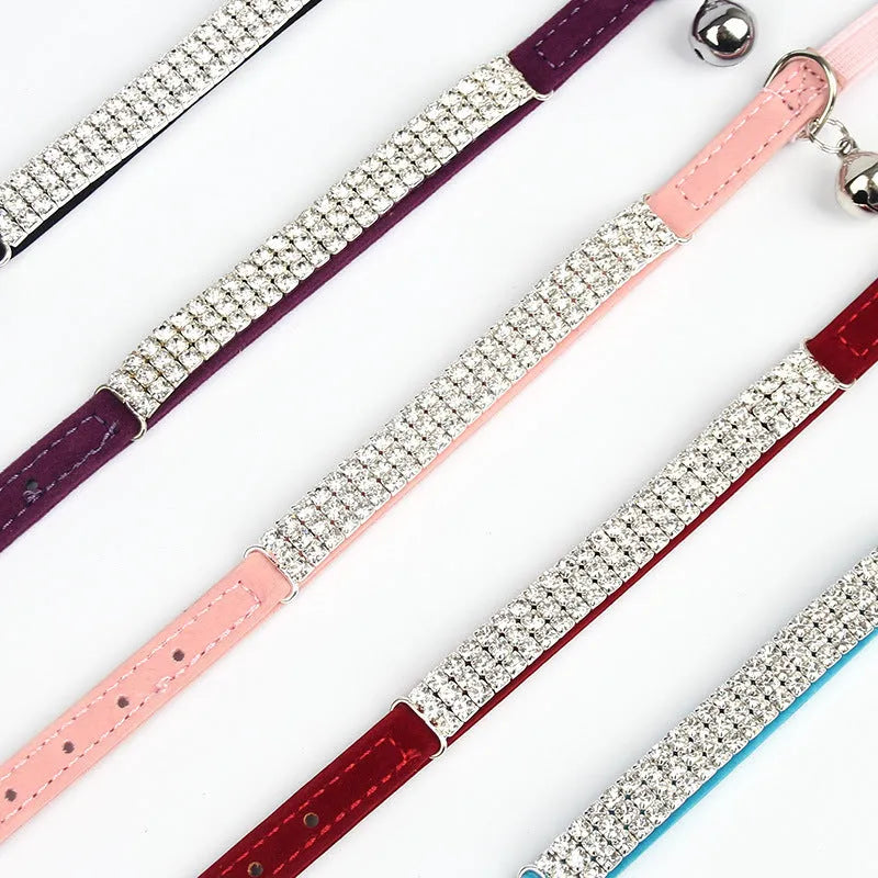 Red velvet cat collar with rhinestone detail showing adjustable 20-30cm length