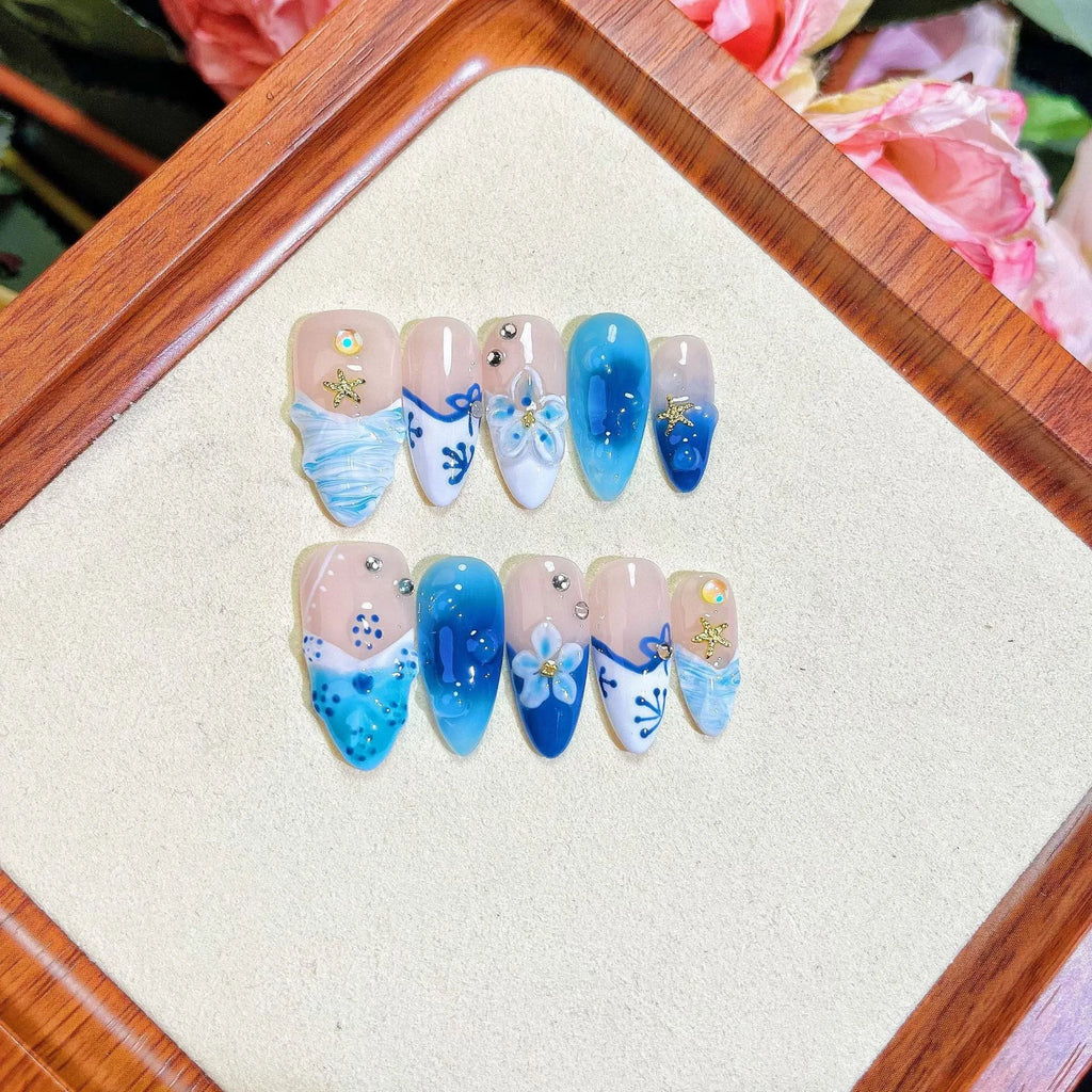 Blue hand-painted carved transparent plastic fake nails set in sizes XS to L