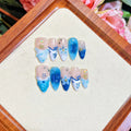 Blue hand-painted carved transparent plastic fake nails set in sizes XS to L