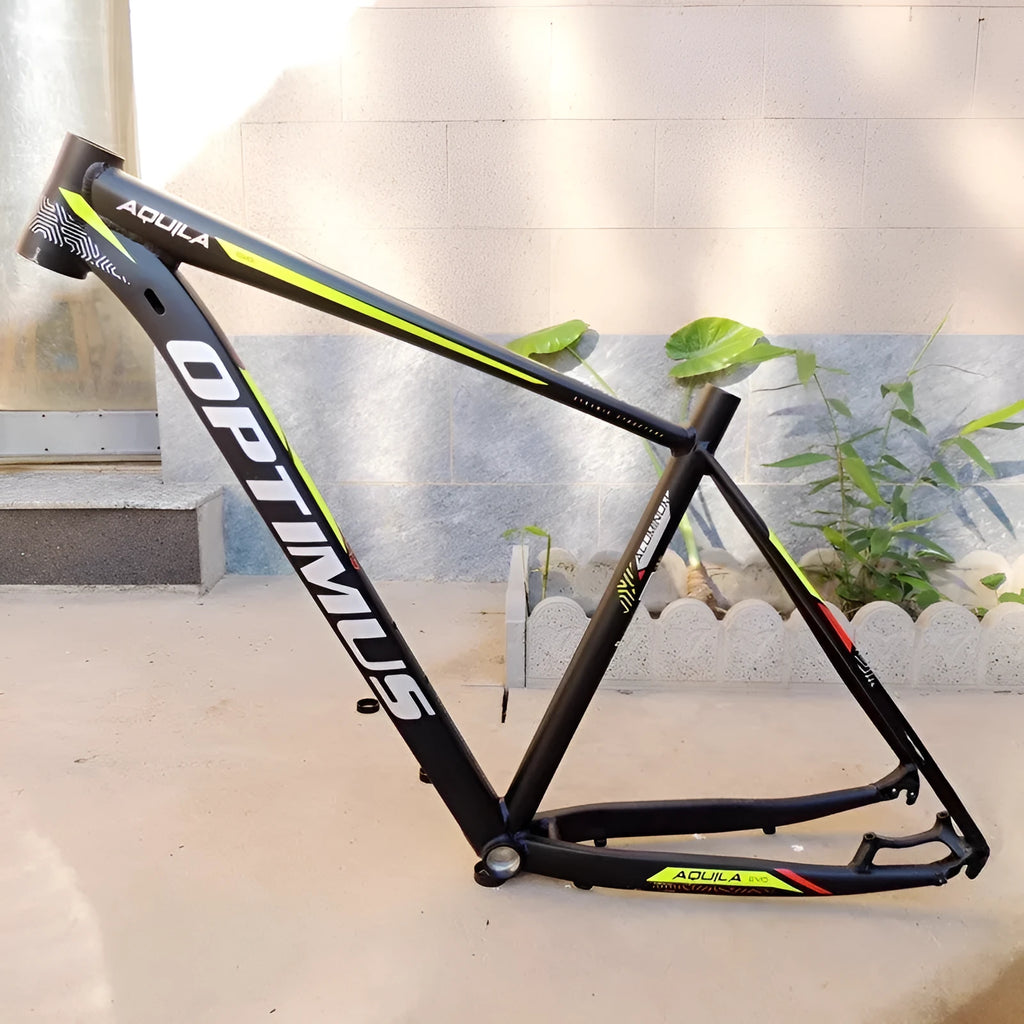 Black green 29-inch aluminium mountain bike frame showing internal cable ports and disc brake mount.