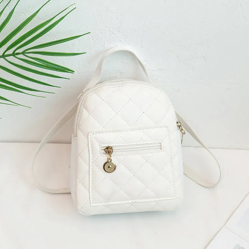 Girls' hard case square backpack with embroidery in white, black, or pink colours, showing soft handle and dimensions.