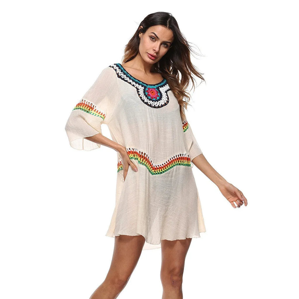 Crocheted ethnic-style white acrylic beach cover-up for women on a mannequin