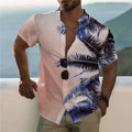 Man wearing a loose floral print short sleeve shirt in a cardigan style on a beach.