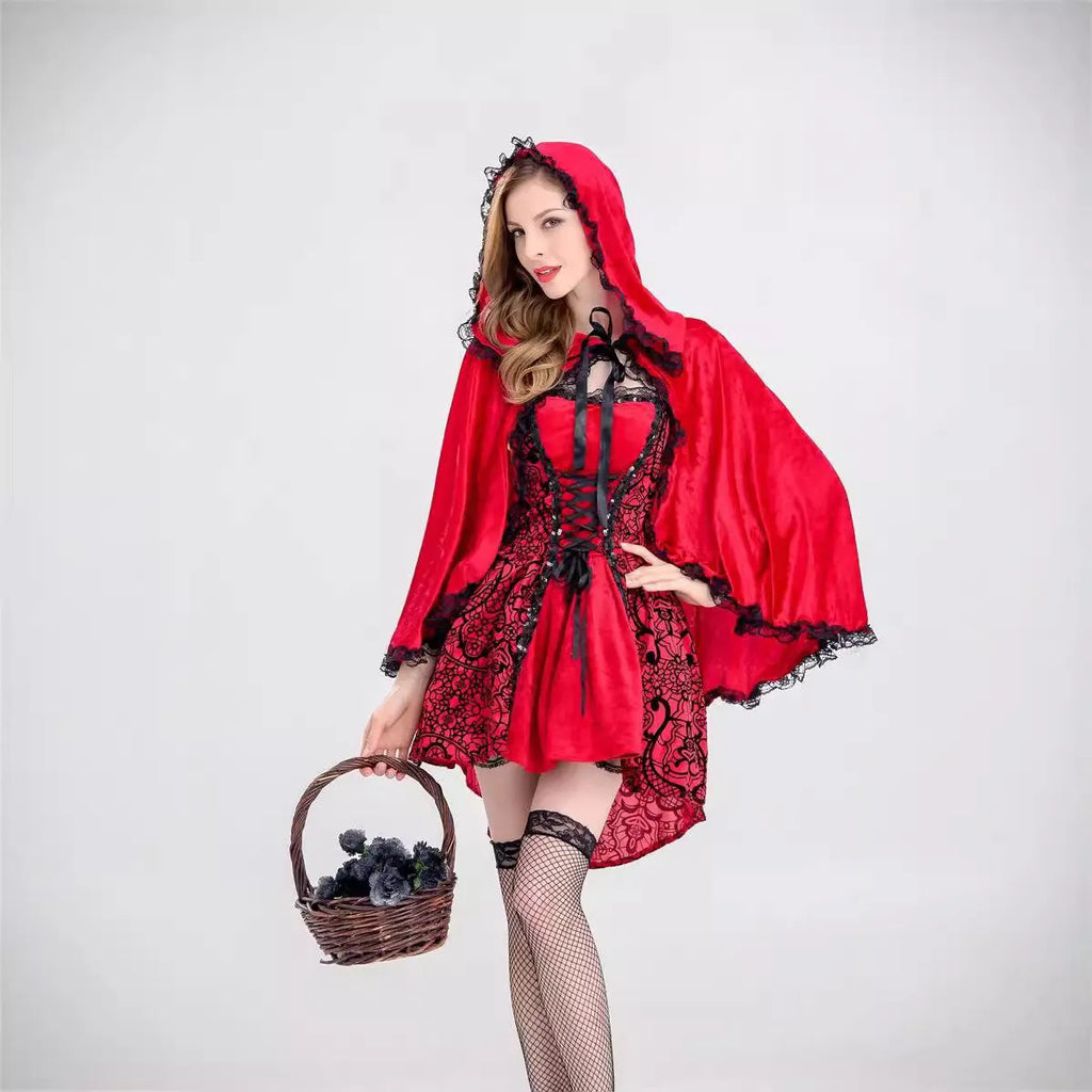 Little Red Riding Hood costume set with dress, shawl, and gloves on a woman standing in a forest scene