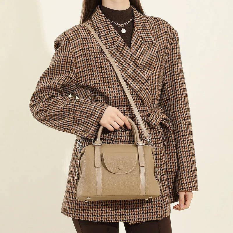 Women's genuine leather handbag in street-trend style with lock closure and contrast stitching