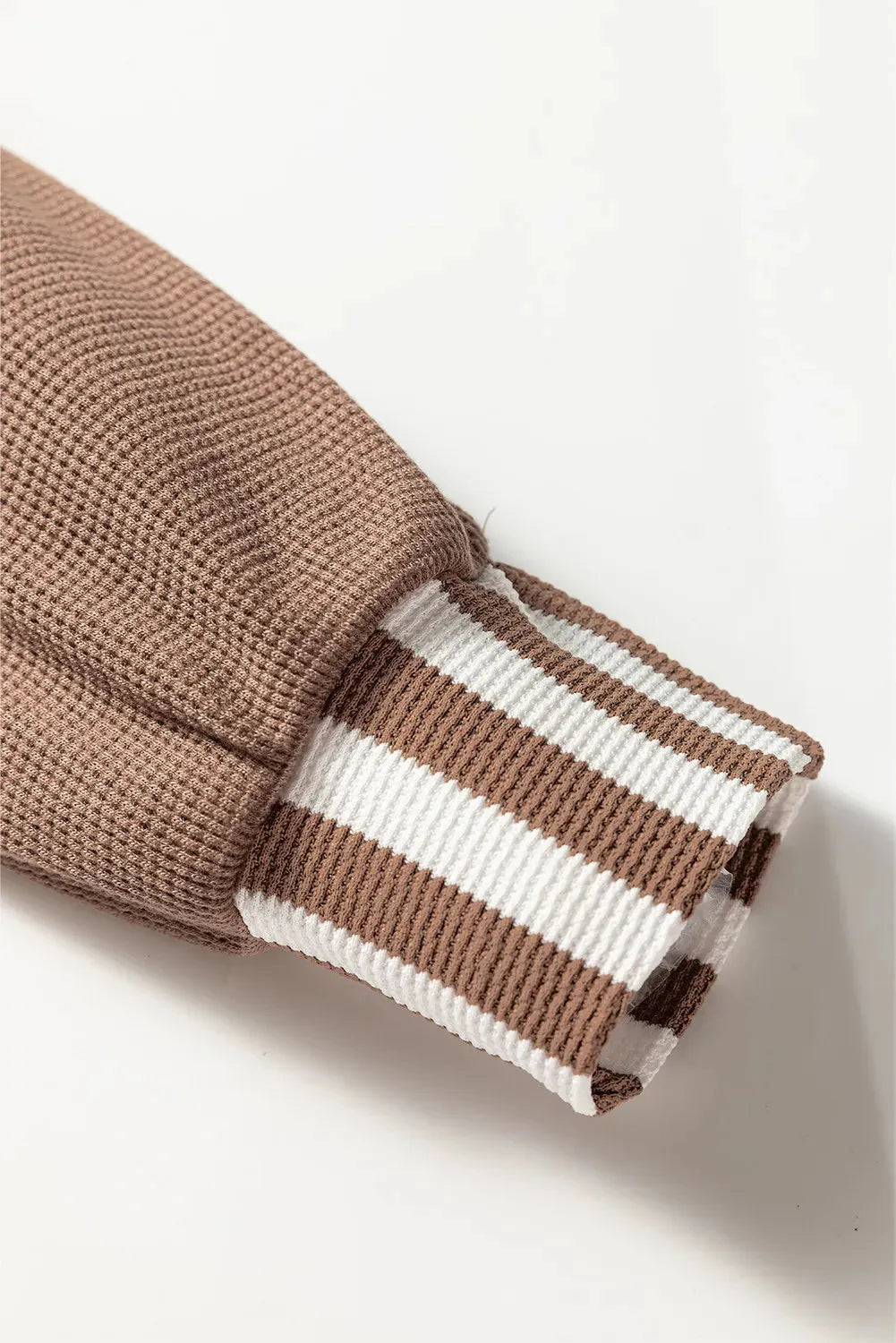 Straw yellow waffle texture hoodie with striped patchwork panels and a button neck.