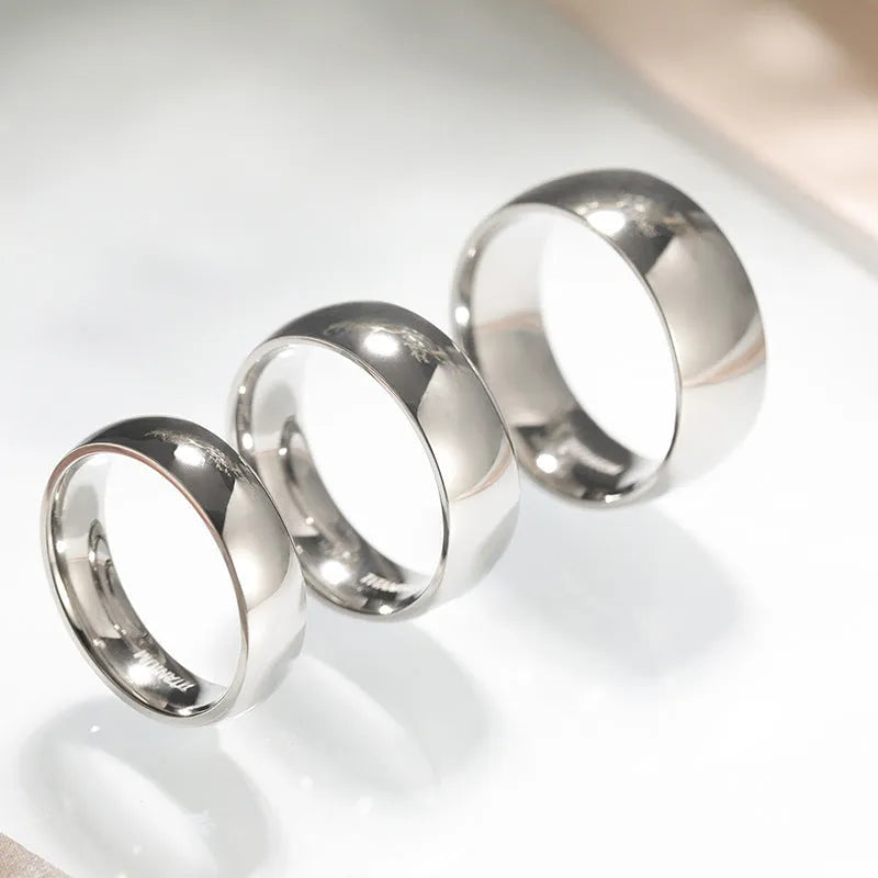 Silver titanium steel unisex ring shown in multiple width options on a size chart.