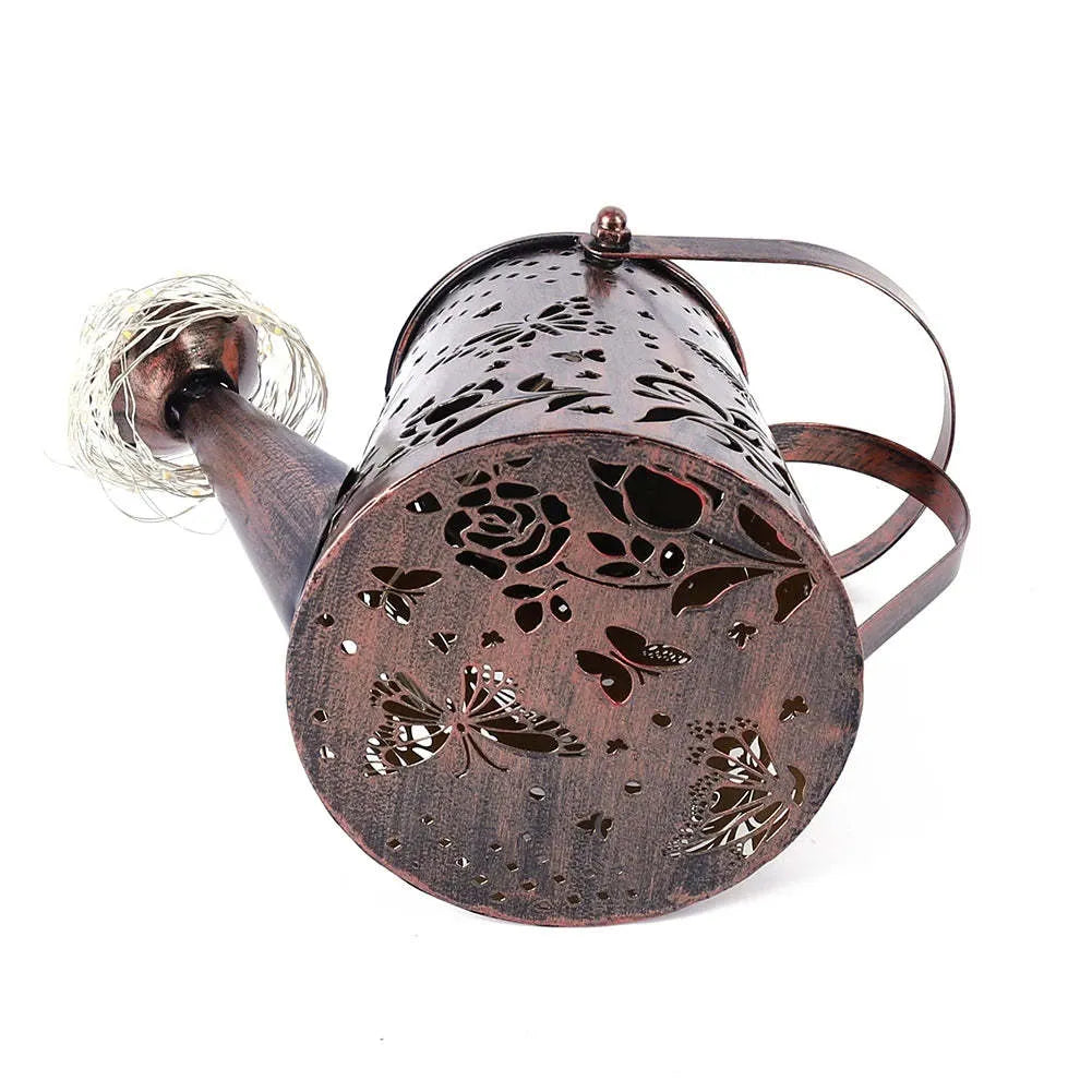 Solar-powered iron butterfly garden lamp with warm white LED lighting for outdoor decorative use
