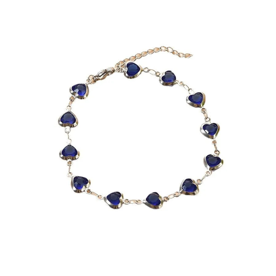 Devil's Eye geometric heart-shaped stainless steel bracelet in an electroplated colour on a wrist.
