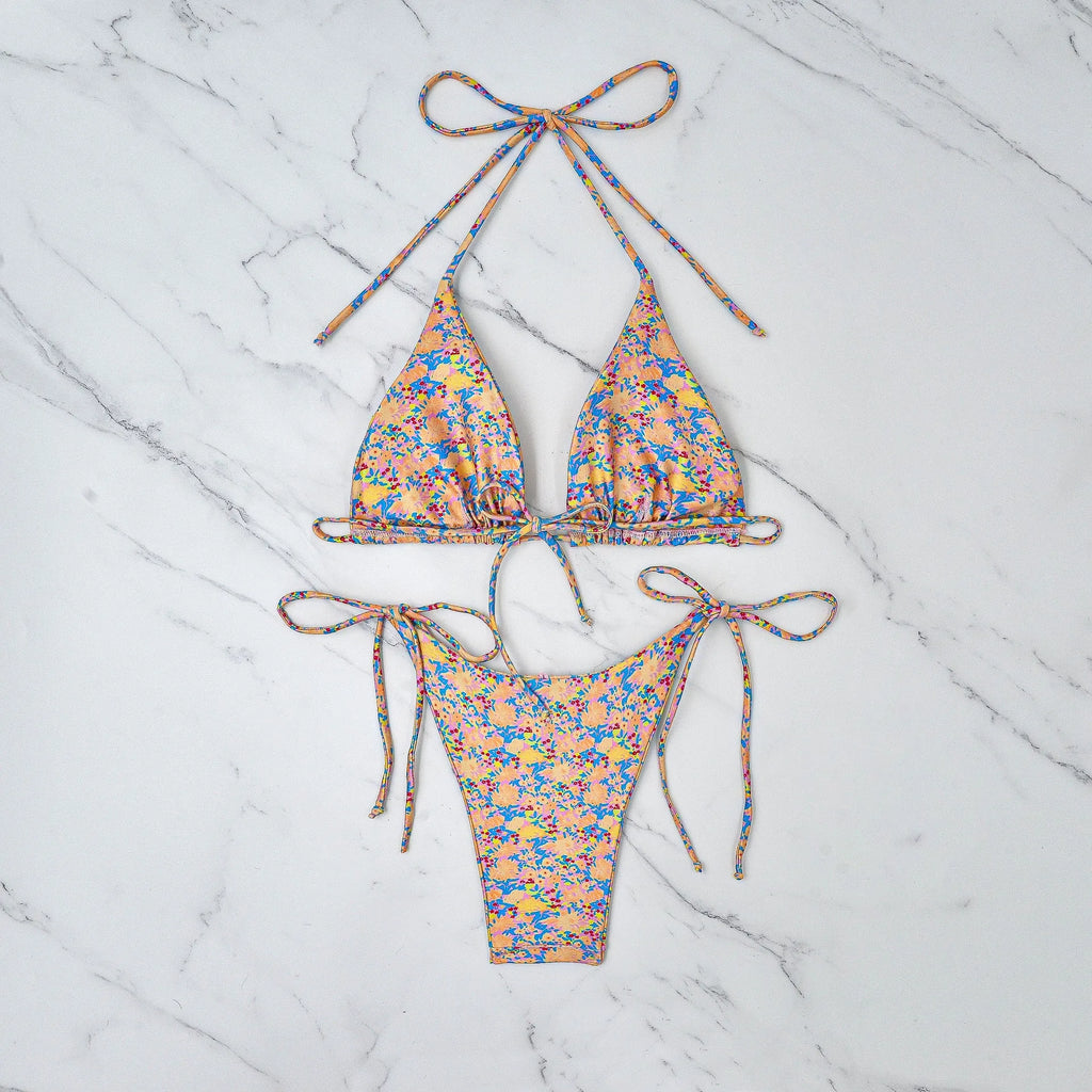 Women's lace-up bikini swimsuit in picture colour, showing backless design and high elasticity fabric.