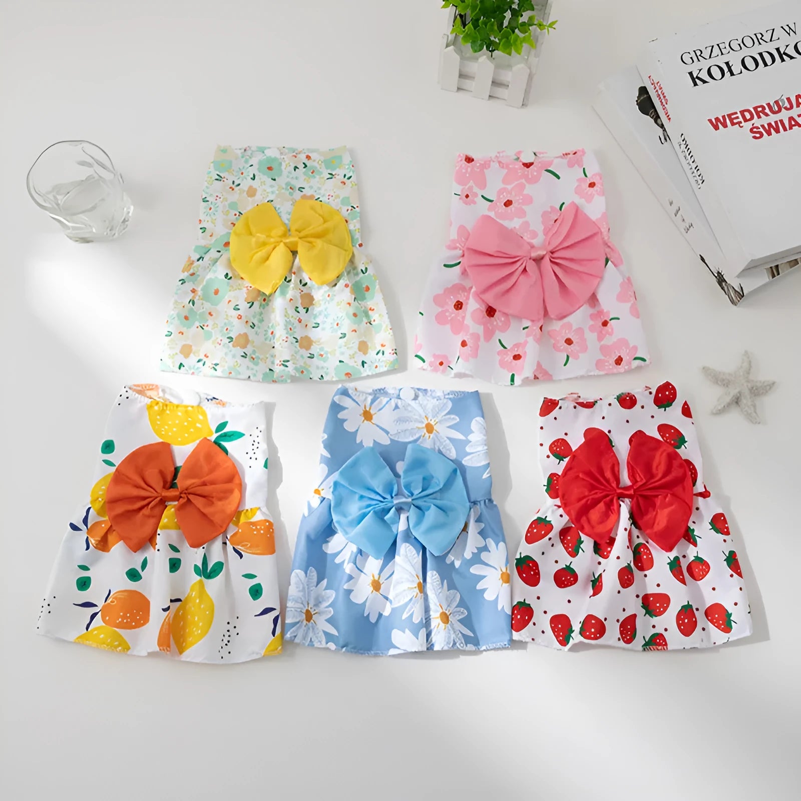 Ultra-thin light orange polyester pet dress for dogs or cats with a floral butterfly knot and bow.