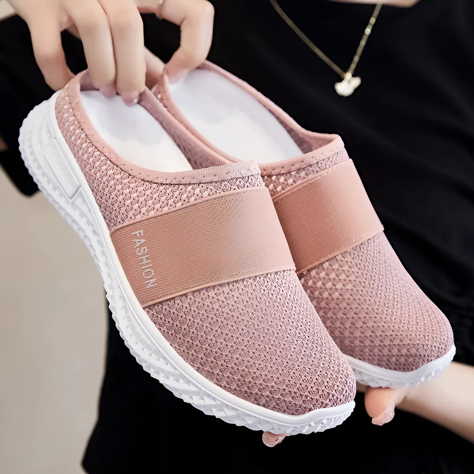 Women's breathable casual shoes with mesh upper and hollow-out design in black, flat heel.