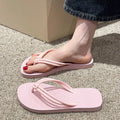 Men's PVC flip flop slippers in beige with a toe-covering design and injection moulded sole.