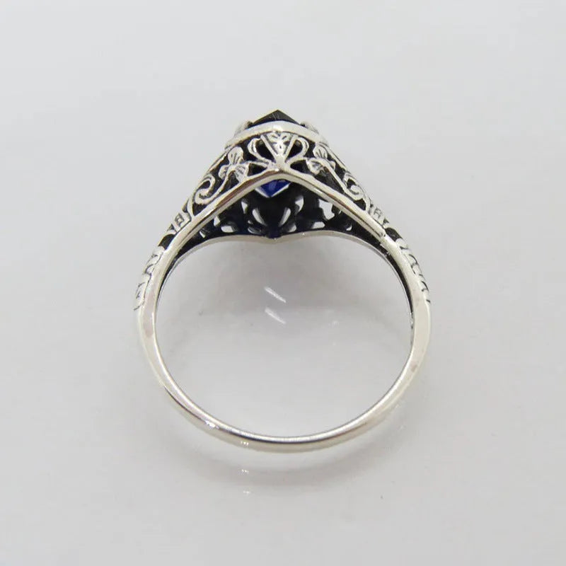 Silver women's ring with geometric hollow pattern and zircon stone on electroplated alloy