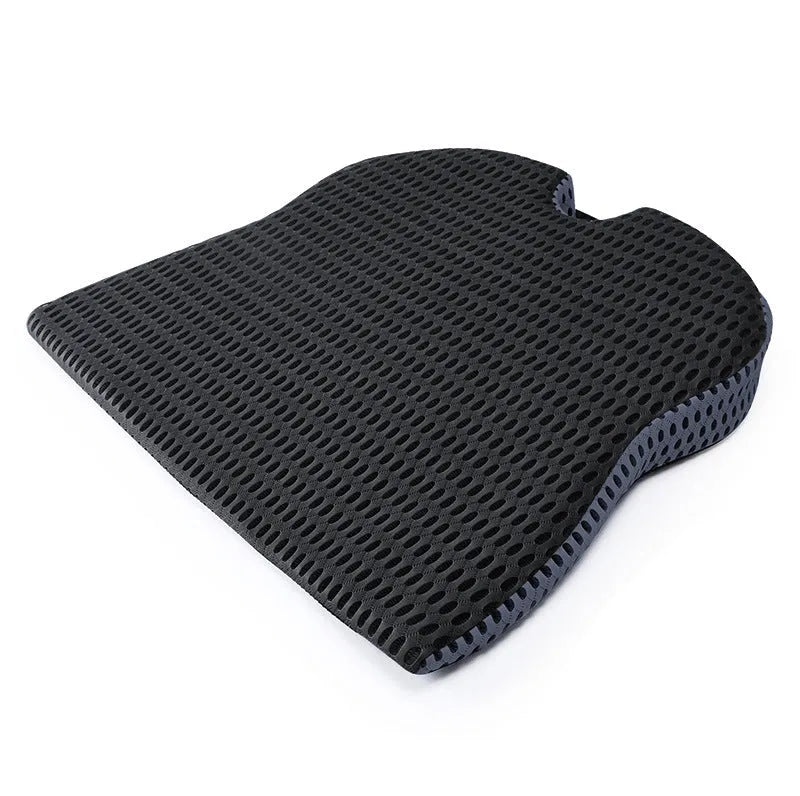 Memory foam car cushion with attachment straps in solid black colour on a car seat