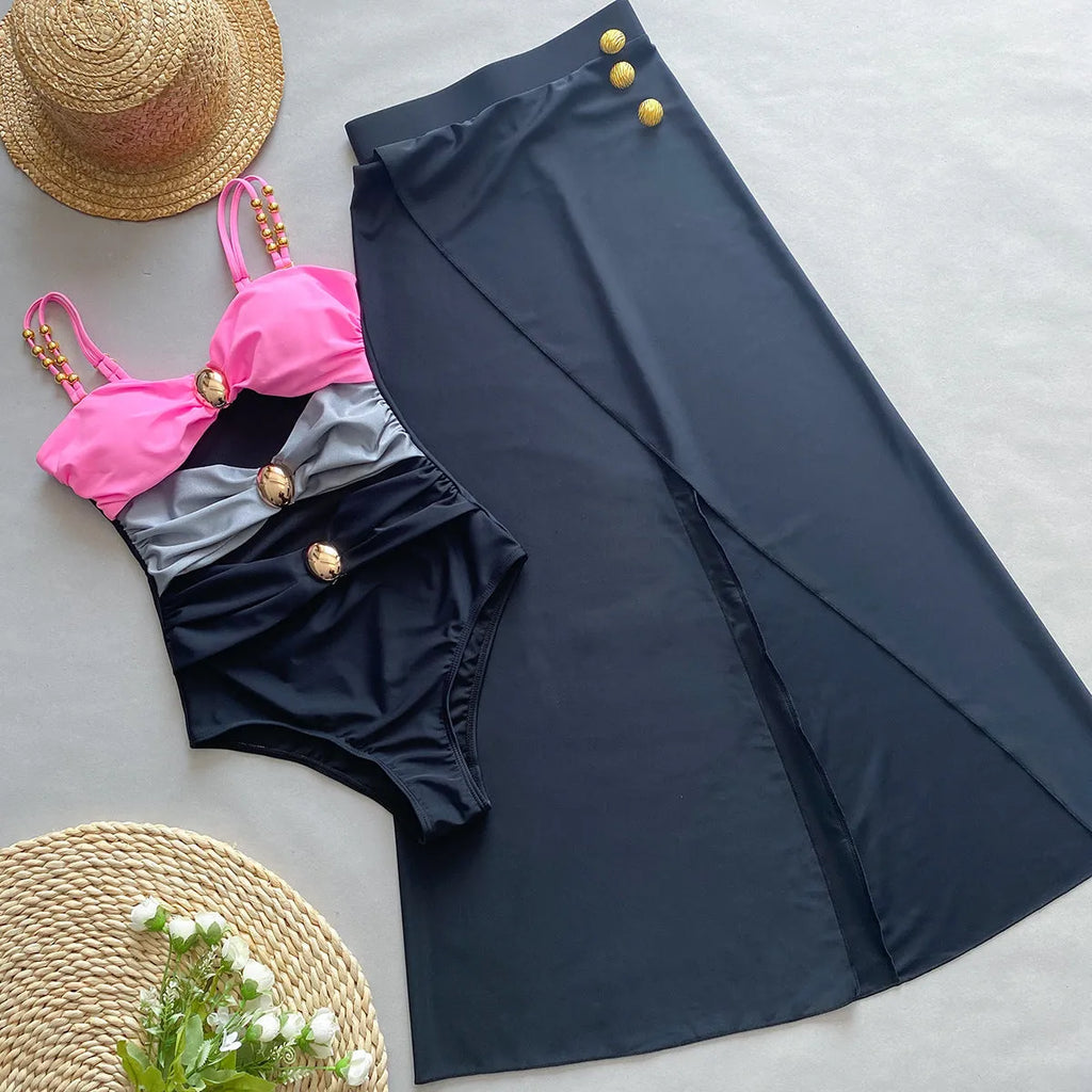 Women's brown one-piece swimsuit with high elasticity and matching beige skirt laid flat.