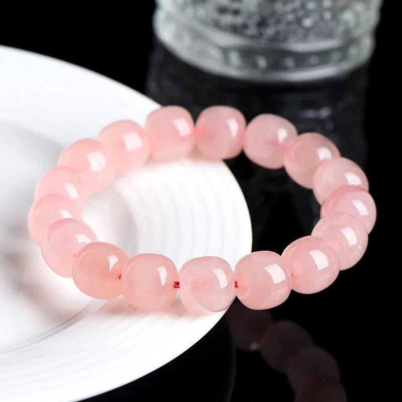 Pink crystal barrel bead bracelet with geometric design and 8 x 10mm beads
