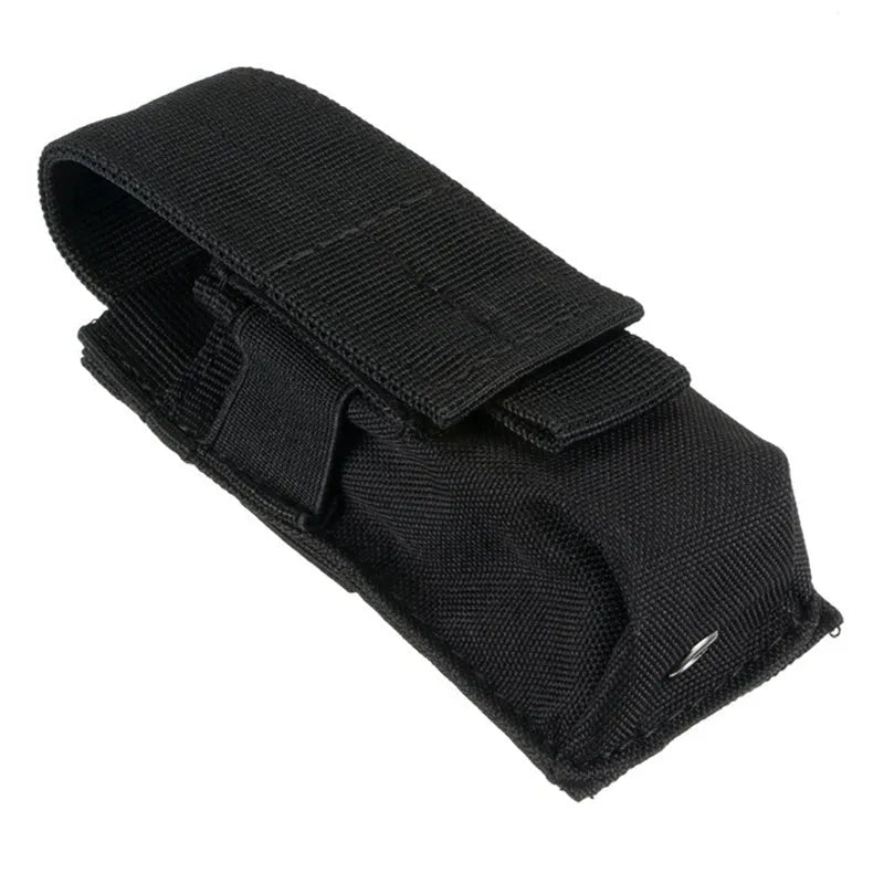 Black 600D nylon MOLLE tactical pouch with elastic cord closure, shown next to a small flashlight for scale.
