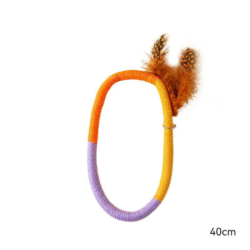 Circular green cotton rope cat toy with feathers for chewing and interactive play